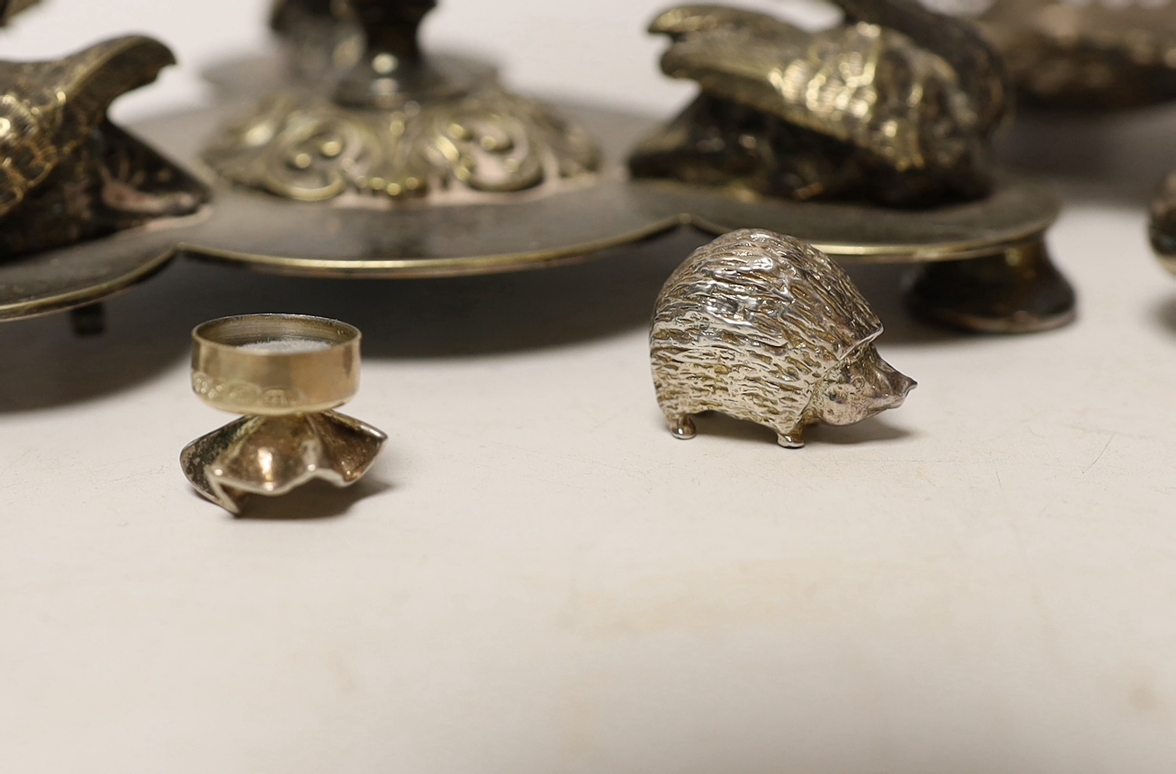 A pair of Edwardian pierced silver bonbon dishes, four other modern silver items and a plated centrepiece with glass vase.